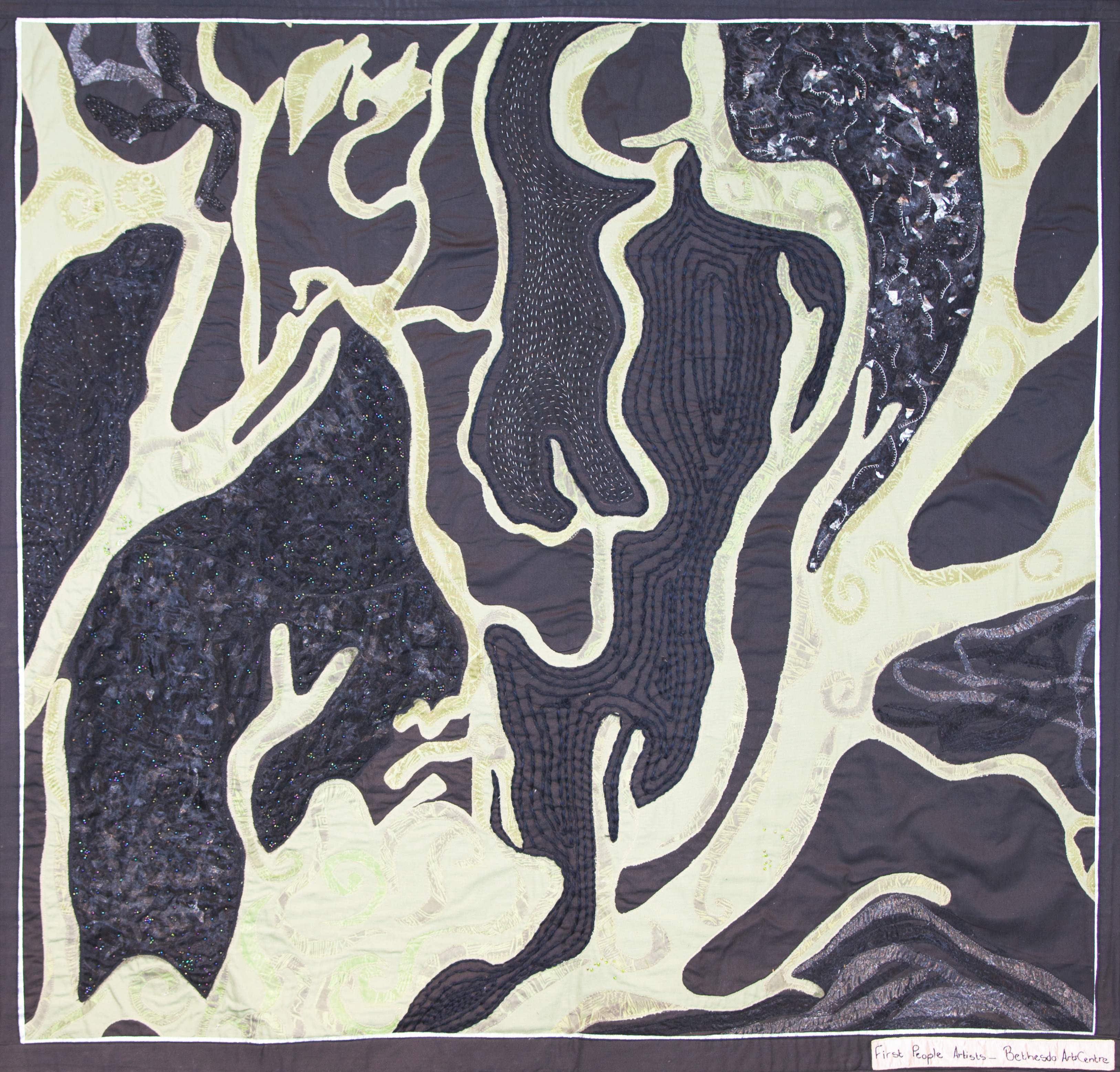 Image showing one of the Shared Sky artworks with the following caption "In Nieu Bethesda, the term Bushman used to be considered abusive. People identified as coloured, having lost language, culture, land, and identity generations ago. Using roots as a symbol for connectedness, the group began to explore the /Xam mythology as a way of connecting to their own ancestral past."