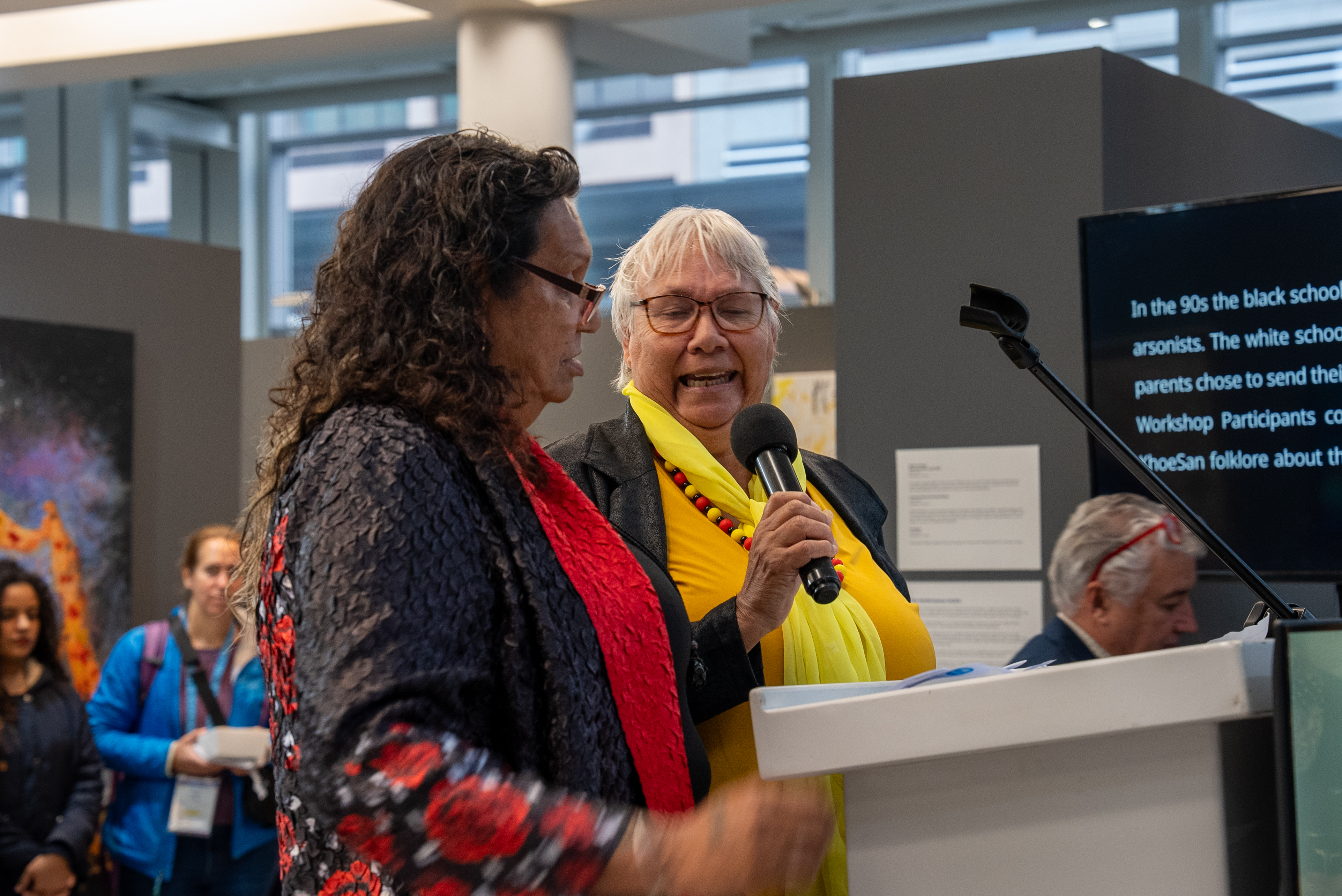 Wajarri Yamaji Aboriginal Corporation Aboriginal Liaison Officer Jennylyn Hamlett (L) and Wajarri artist Gail Rose Simpson (R) speaking at the launch of the Cosmic Echoes exhibition in Cape Town .
