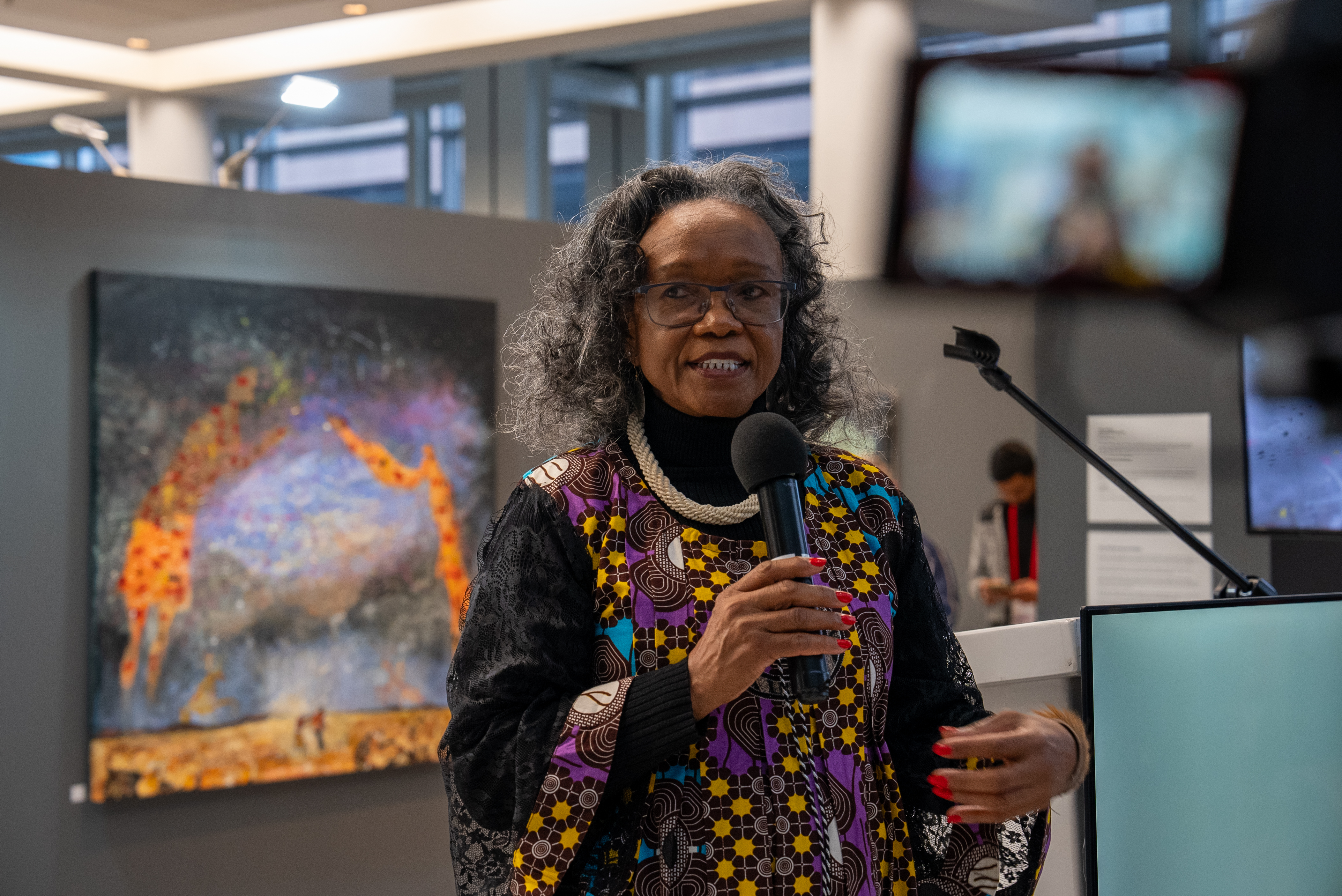 Exhibition curator, Sylvia Vollenhoven at Cosmic Echoes launch event in Cape Town. Artwork featured: Open Sky, Pierre Cloete