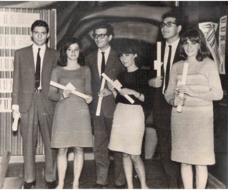 A black and white photo of Catherine Cesarsky (second from left) and her husband (third from left) with friends following their university graduation in Buenos Aires in 1966.