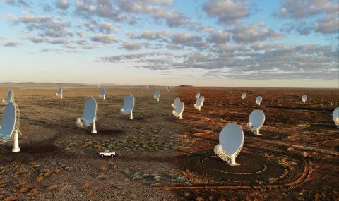 Composite image: Artist's impression of the SKA-Mid telescope on the left blends into a real image of the MeerKAT telescope on the right
