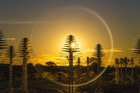 Prototype SKA-Low antennas on site in Australia with the sun setting behind