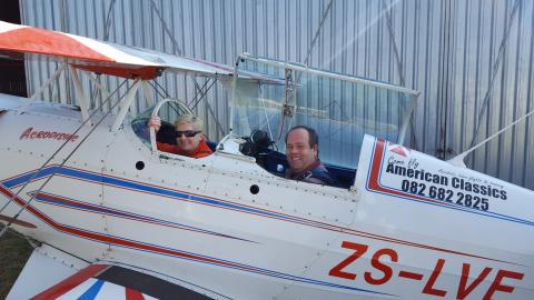 Tracy Cheetham in a small two-seater plane