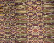 Printed cotton sheet showing oval shapes representing woody pears in brown colours. 