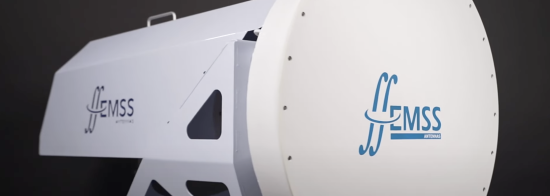 A digital model of the Band 2 feed. The component has a white structure with on the right side a circular drum-like part with the EMSS Antennas logo. 