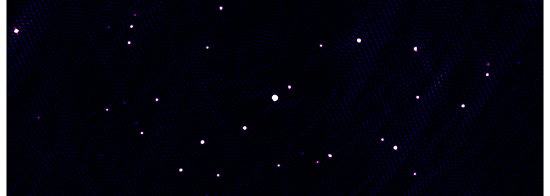 A picture of radio galaxies in the sky that look like tens of white and pink specks of paint spread over a dark canvas.