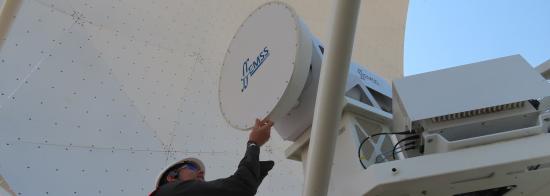 Picture of someone wearing a high-vis jacket working on a telescope receiver.