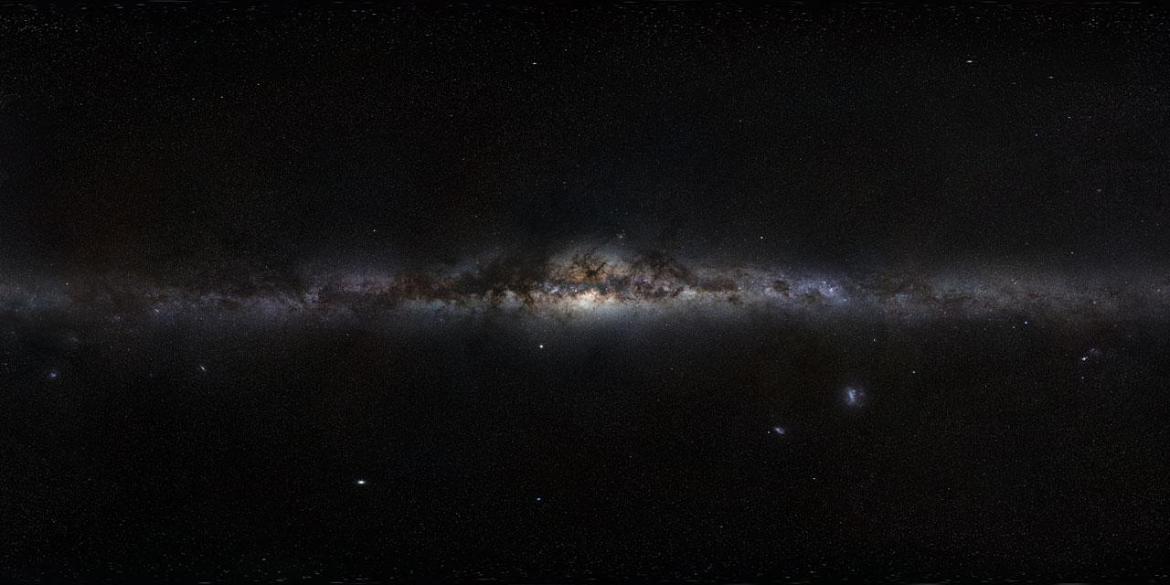 The Milky Way panorama showing its disc, marbled with both dark and glowing nebulae, which harbours bright, young stars, as well as the Galaxy’s central bulge and its satellite galaxies. Credit: ESO/S. Brunier