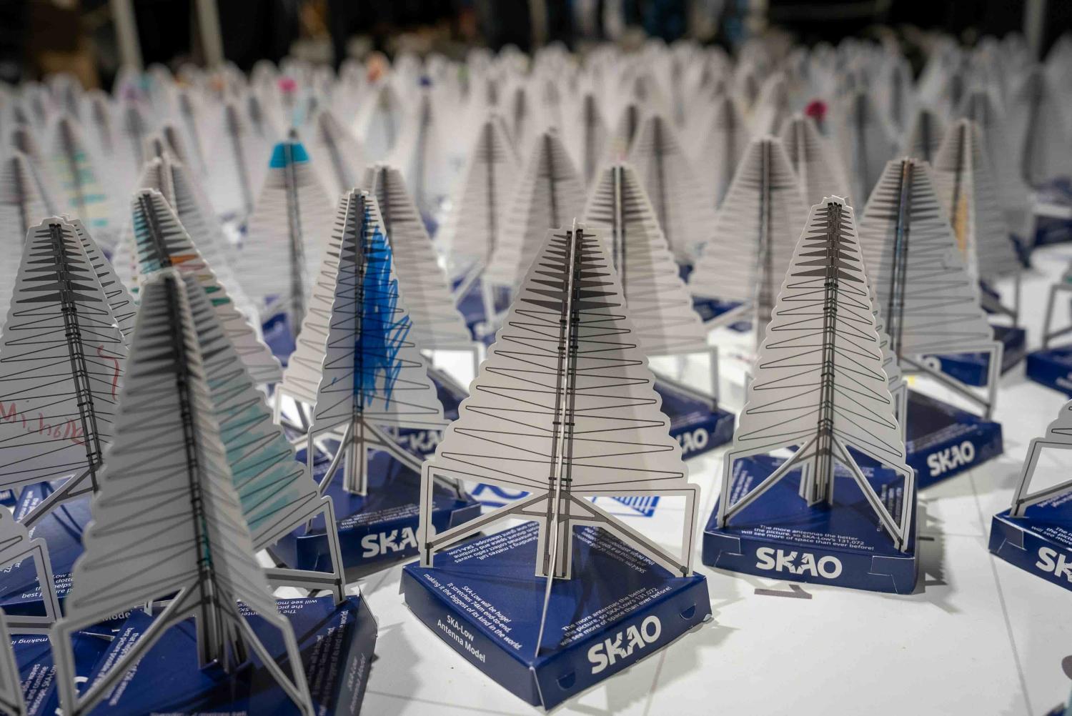 Picture of many paper antenna models close together on a white surface.