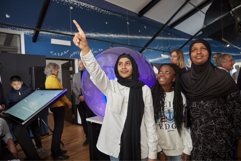 Picture of three young girls at a science visitor centre.