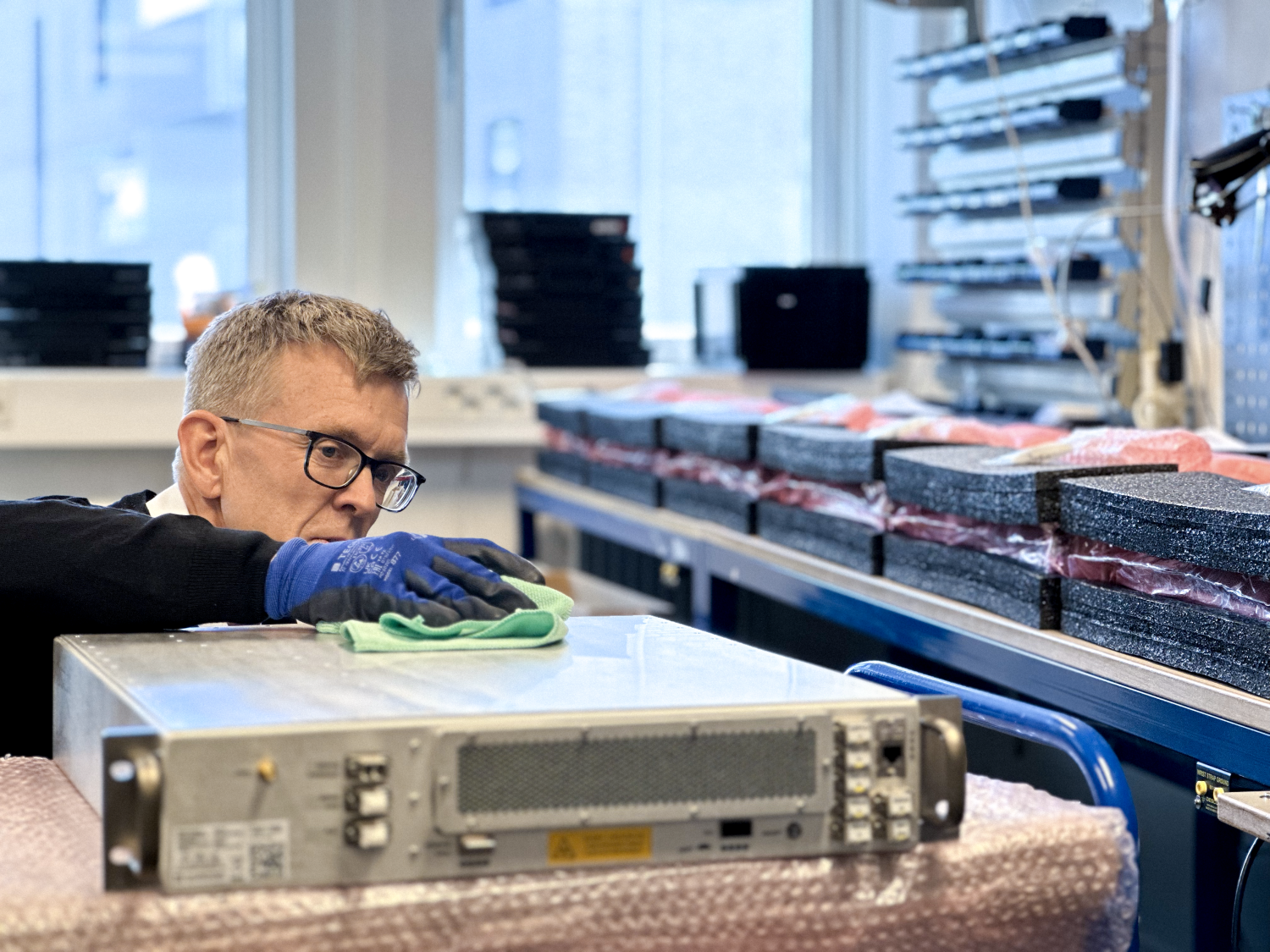 A man working on a piece of computer hardware
